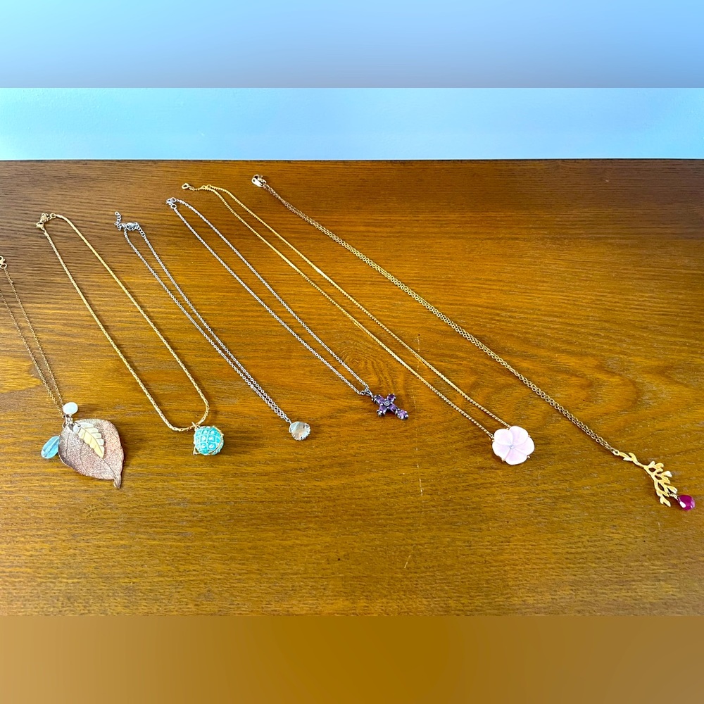 Set of Six Gold and Silver Necklaces- flower, cross, locket, leaf, and more